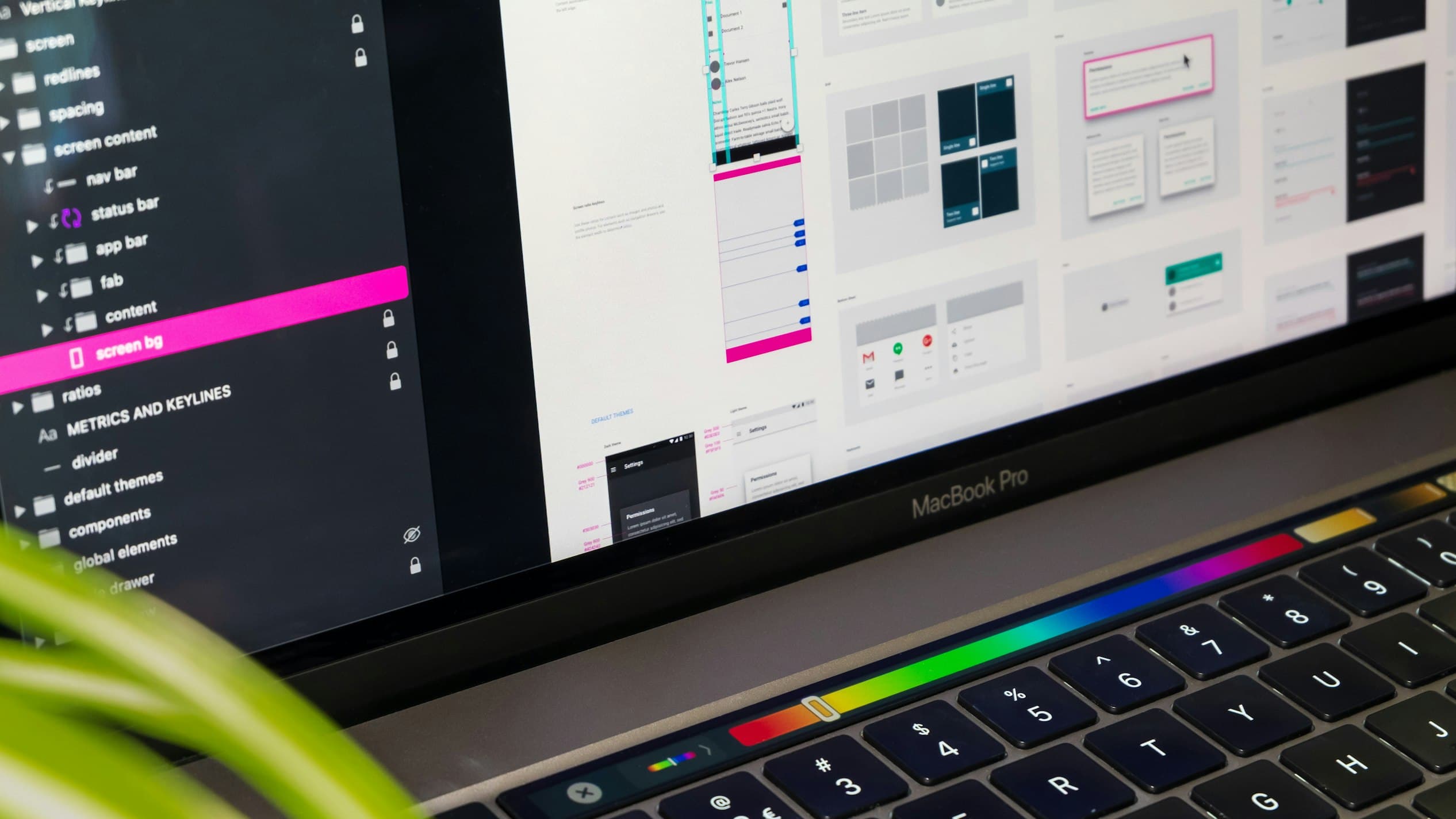 Designer reviewing digital signage content on a screen in a design studio